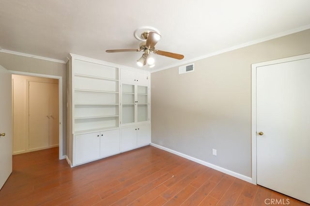 2158 N Ave, Chico, CA 95926 - unfurnished bedroom with wood finished floors, crown molding, and a ceiling fan