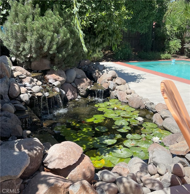 2158 N Ave, Chico, CA 95926 - outdoor pool featuring a small pond