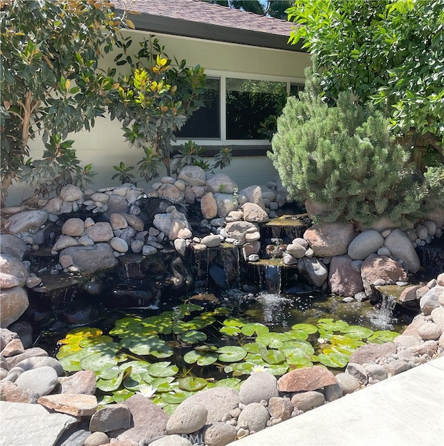 2158 N Ave, Chico, CA 95926 - exterior view of a garden pond and roof with shingles