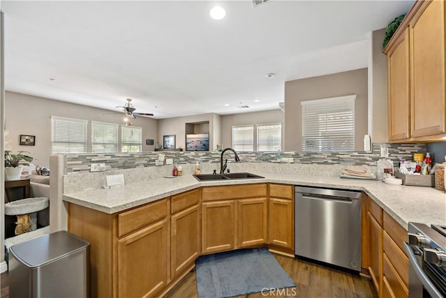 15655 Vista Way Unit 100, Lake Elsinore, CA 92532 - kitchen with appliances with stainless steel finishes, a peninsula, decorative backsplash, a ceiling fan, and recessed lighting