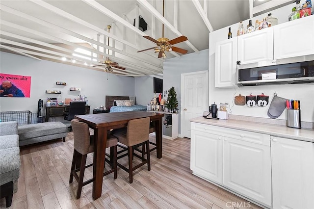 637 N 2nd Ave, Upland, CA 91786 - dining room featuring ceiling fan, light wood-style flooring, and high vaulted ceiling