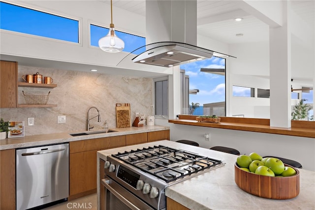 1094 Katella St, Laguna Beach, CA 92651 - kitchen with appliances with stainless steel finishes, island range hood, brown cabinetry, tasteful backsplash, and light countertops
