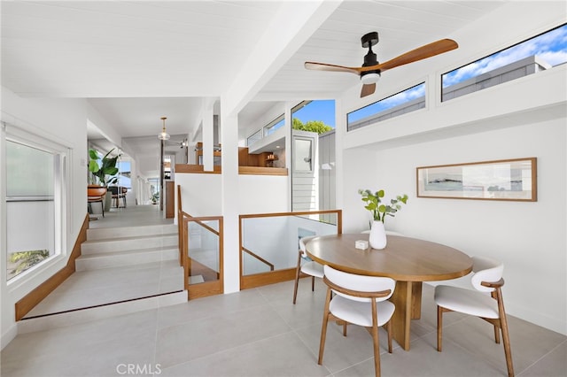 1094 Katella St, Laguna Beach, CA 92651 - dining area with healthy amount of natural light, a ceiling fan, beamed ceiling, and tile patterned flooring