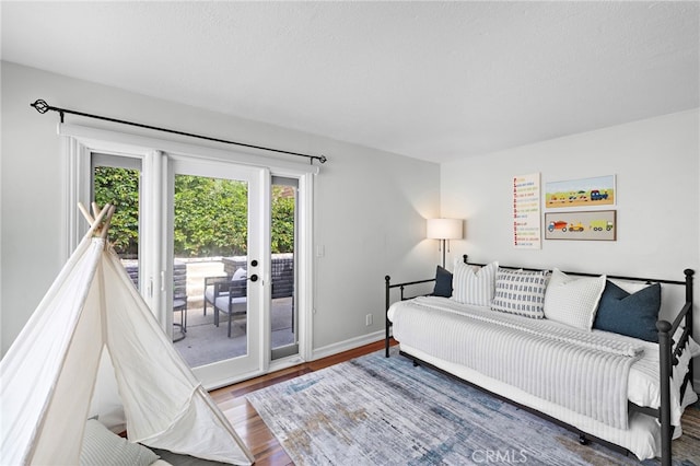 1094 Katella St, Laguna Beach, CA 92651 - bedroom with access to exterior, wood finished floors, and french doors