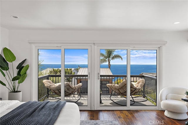 1094 Katella St, Laguna Beach, CA 92651 - bedroom featuring access to outside, a water view, hardwood / wood-style floors, and recessed lighting