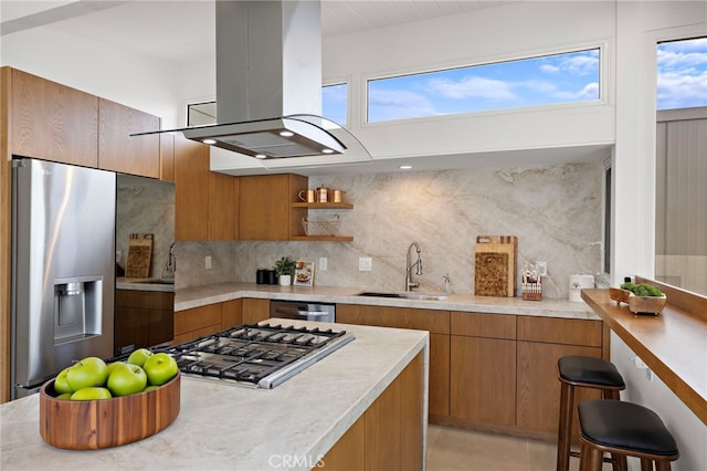 1094 Katella St, Laguna Beach, CA 92651 - kitchen with island range hood, brown cabinetry, and stainless steel appliances