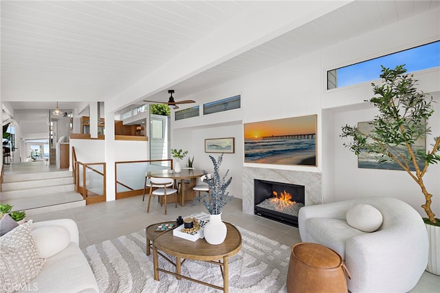 1094 Katella St, Laguna Beach, CA 92651 - tiled living area with a warm lit fireplace and a ceiling fan
