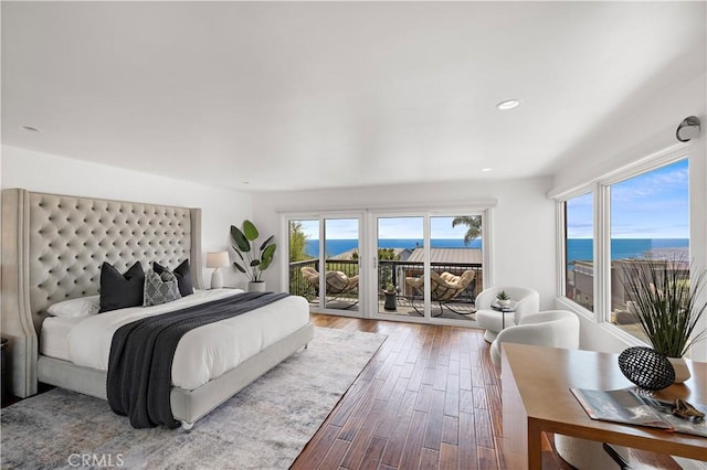 1094 Katella St, Laguna Beach, CA 92651 - bedroom featuring access to outside, wood finished floors, multiple windows, recessed lighting, and a water view