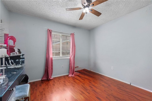 178 E 49th St, Los Angeles, CA 90011 - office area with a textured ceiling, ceiling fan, and wood finished floors