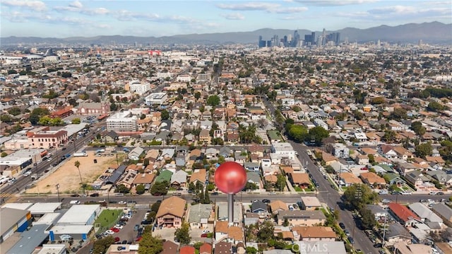 178 E 49th St, Los Angeles, CA 90011 - aerial view of property and surrounding area featuring a mountain backdrop