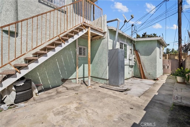 178 E 49th St, Los Angeles, CA 90011 - view of property exterior with stucco siding, a patio, and stairs