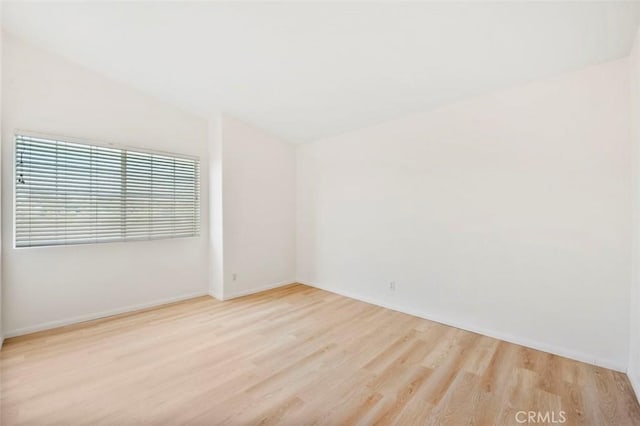 42140 Lyndie Ln Unit 12, Temecula, CA 92591 - empty room featuring wood finished floors and lofted ceiling