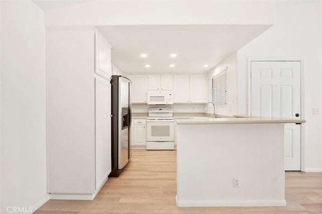 42140 Lyndie Ln Unit 12, Temecula, CA 92591 - kitchen featuring white appliances, light wood finished floors, white cabinets, recessed lighting, and light countertops