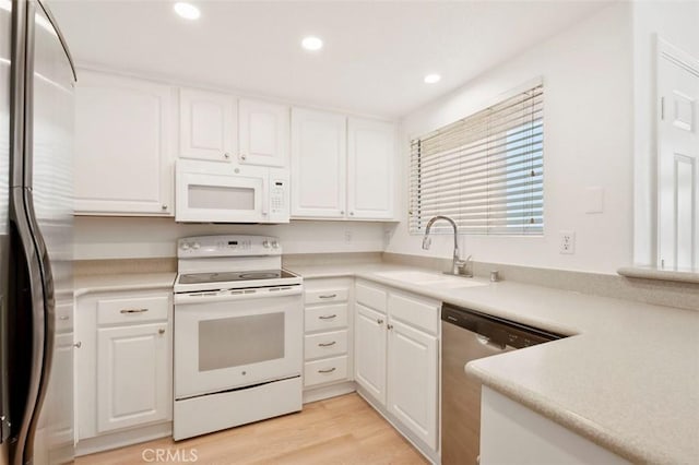 42140 Lyndie Ln Unit 12, Temecula, CA 92591 - kitchen featuring appliances with stainless steel finishes, white cabinets, recessed lighting, and light countertops