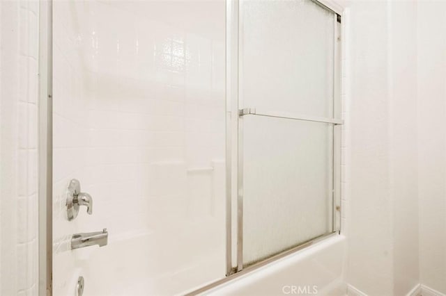 42140 Lyndie Ln Unit 12, Temecula, CA 92591 - bathroom with combined bath / shower with glass door and baseboards