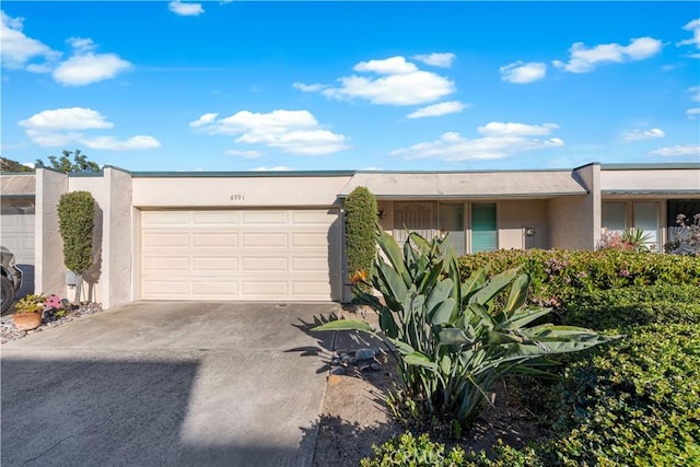 6991 Caminito Perico, San Diego, CA 92119 - view of front of house featuring driveway, a garage, and stucco siding