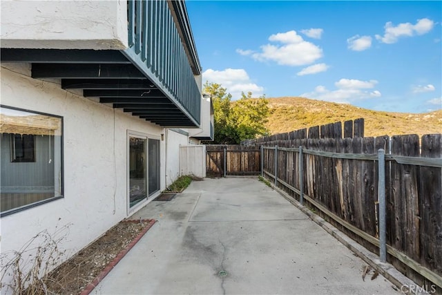6991 Caminito Perico, San Diego, CA 92119 - fenced backyard with a patio
