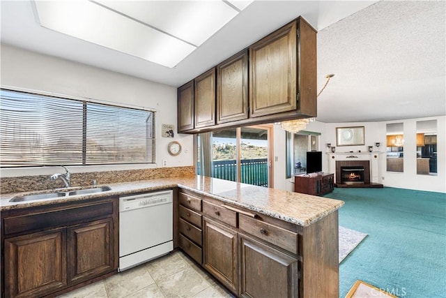 6991 Caminito Perico, San Diego, CA 92119 - kitchen featuring dishwasher, a tile fireplace, a peninsula, open floor plan, and light countertops