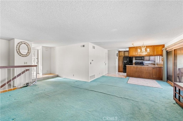 6991 Caminito Perico, San Diego, CA 92119 - unfurnished living room with a textured ceiling, a chandelier, and light carpet