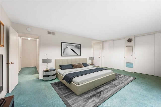 6991 Caminito Perico, San Diego, CA 92119 - carpeted bedroom featuring two closets