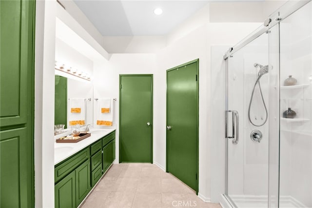 1026 N Turner Ave Unit 223, Ontario, CA 91764 - bathroom featuring double vanity, a shower stall, tile patterned floors, and recessed lighting