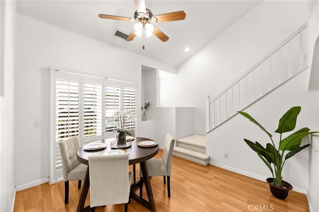 1026 N Turner Ave Unit 223, Ontario, CA 91764 - dining space with light wood-style flooring, ceiling fan, recessed lighting, and stairs