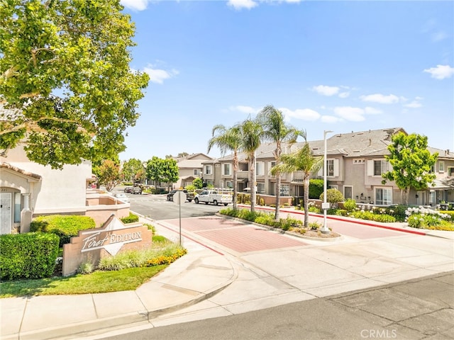 1026 N Turner Ave Unit 223, Ontario, CA 91764 - view of asphalt street with a residential view, curbs, and sidewalks
