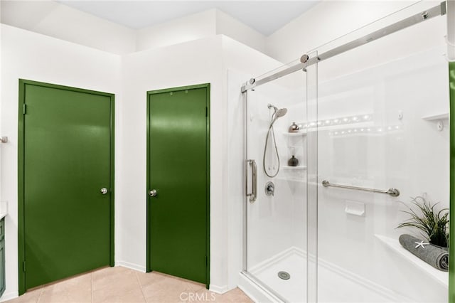 1026 N Turner Ave Unit 223, Ontario, CA 91764 - bathroom featuring a shower stall and tile patterned floors