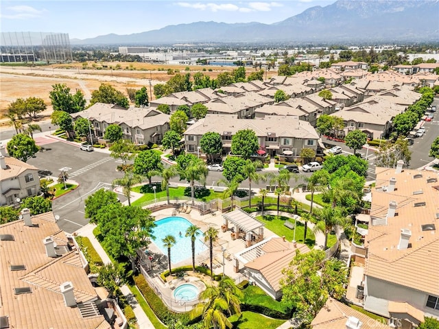 1026 N Turner Ave Unit 223, Ontario, CA 91764 - aerial view of residential area featuring a pool and a mountainous background