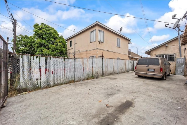 5840 S Olive St, Los Angeles, CA 90003 - view of side of home featuring stucco siding