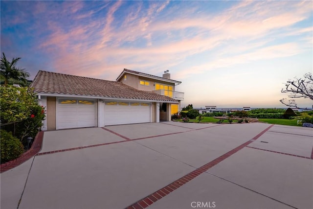3823 Via Manzana, San Clemente, CA 92673 - view of front of property with driveway, a tiled roof, a garage, a balcony, and a chimney