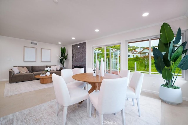 3823 Via Manzana, San Clemente, CA 92673 - dining room featuring recessed lighting, ornamental molding, light tile patterned floors, and a fireplace