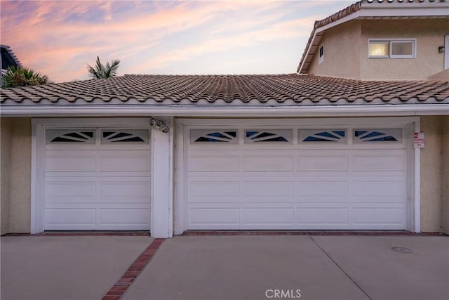 3823 Via Manzana, San Clemente, CA 92673 - garage at dusk with concrete driveway