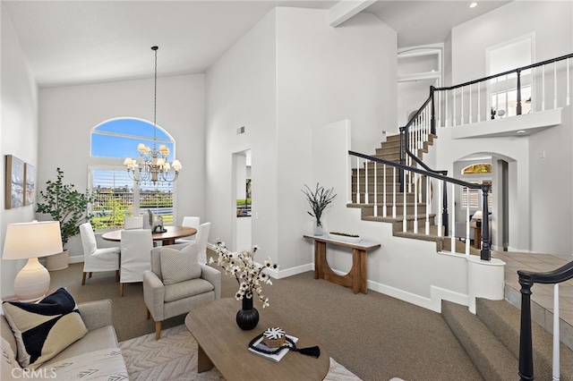 10 Novilla, Laguna Niguel, CA 92677 - carpeted living area featuring high vaulted ceiling, a chandelier, arched walkways, and stairs