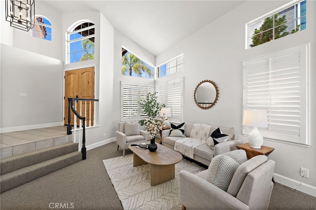 10 Novilla, Laguna Niguel, CA 92677 - living room featuring a high ceiling, carpet flooring, stairway, and a chandelier