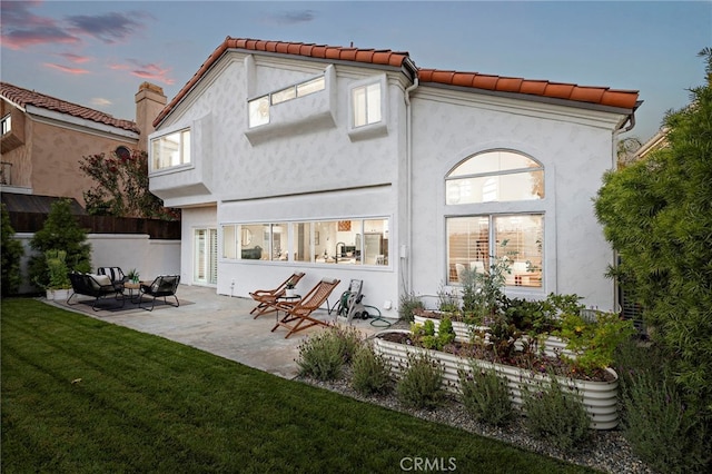 10 Novilla, Laguna Niguel, CA 92677 - back of house with a patio, stucco siding, and a tiled roof
