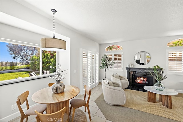 10 Novilla, Laguna Niguel, CA 92677 - dining area featuring a warm lit fireplace and light tile patterned flooring