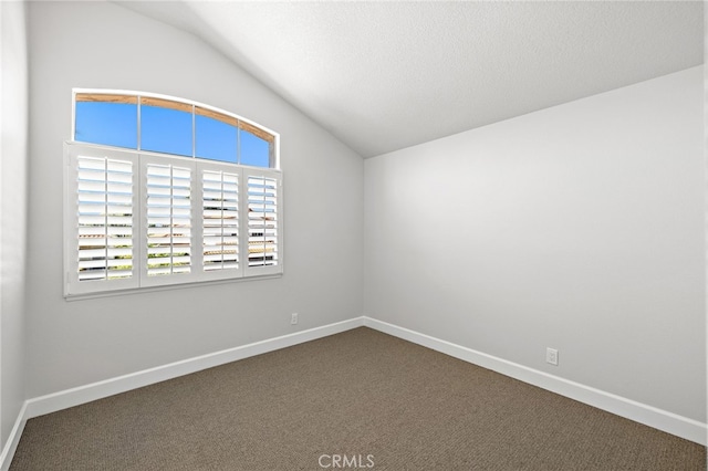 10 Novilla, Laguna Niguel, CA 92677 - unfurnished room with lofted ceiling and dark carpet