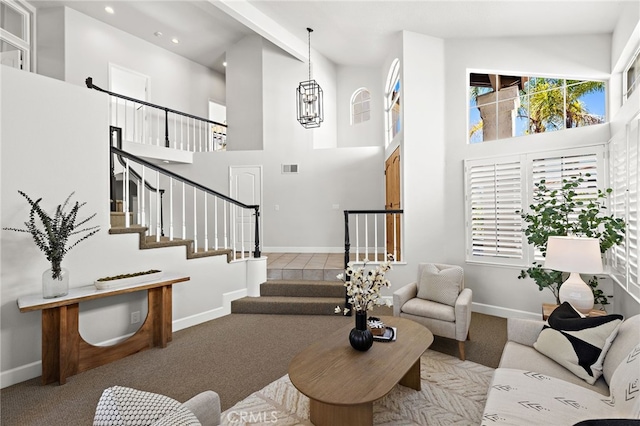 10 Novilla, Laguna Niguel, CA 92677 - carpeted living area with a towering ceiling, recessed lighting, stairway, healthy amount of natural light, and a chandelier