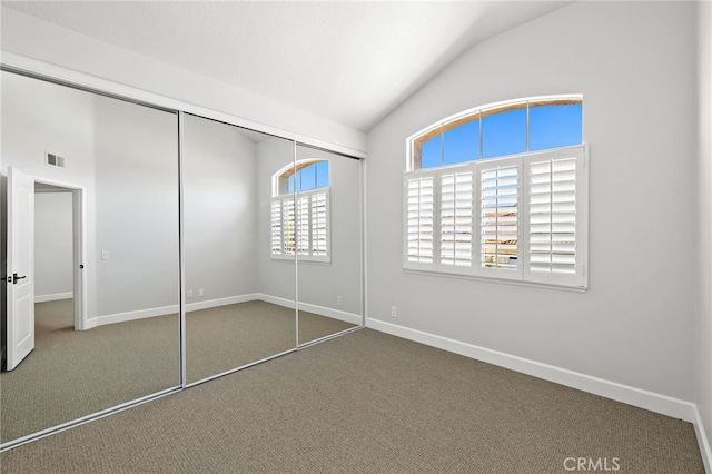 10 Novilla, Laguna Niguel, CA 92677 - unfurnished bedroom with lofted ceiling, carpet, and a closet