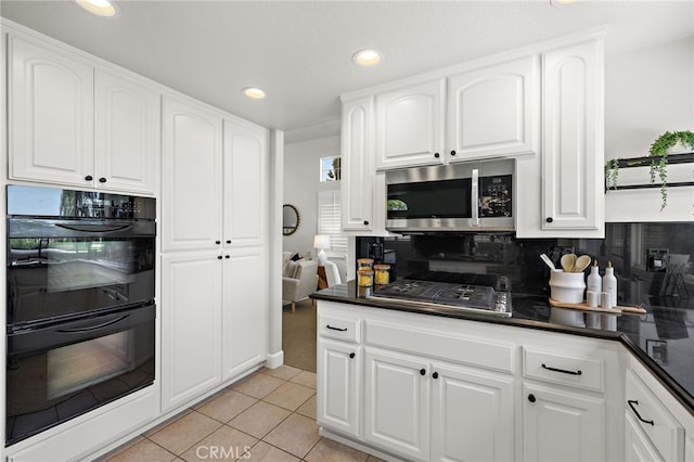 10 Novilla, Laguna Niguel, CA 92677 - kitchen featuring stainless steel appliances, dark countertops, recessed lighting, white cabinetry, and backsplash