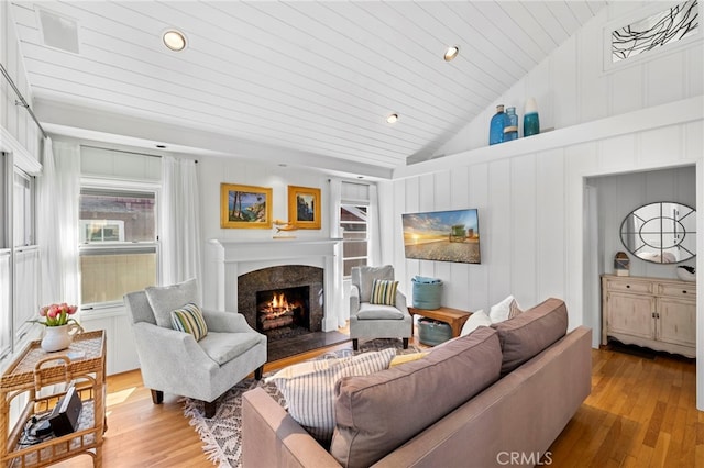 430 Anita St, Laguna Beach, CA 92651 - living area with vaulted ceiling, light wood-type flooring, a fireplace, a decorative wall, and wood ceiling