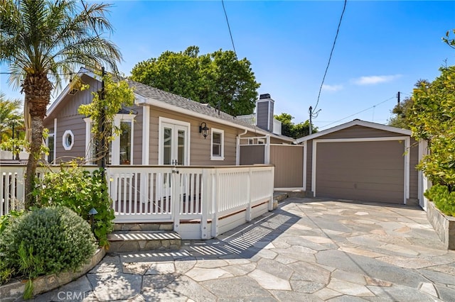 430 Anita St, Laguna Beach, CA 92651 - view of front of property with a chimney, an outbuilding, and driveway