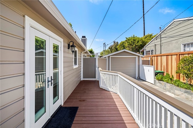 430 Anita St, Laguna Beach, CA 92651 - wooden terrace featuring french doors, an outbuilding, and a garage