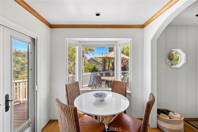 430 Anita St, Laguna Beach, CA 92651 - dining space with plenty of natural light, light wood finished floors, crown molding, and arched walkways
