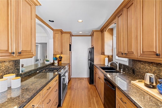 430 Anita St, Laguna Beach, CA 92651 - kitchen with black appliances, light wood-style flooring, tasteful backsplash, dark stone counters, and recessed lighting