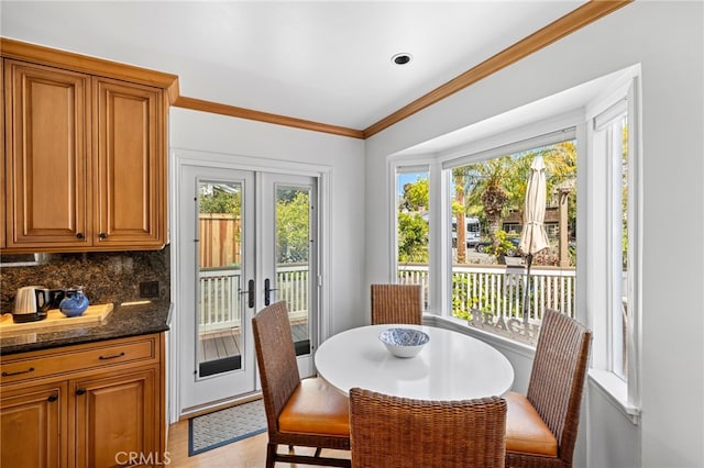 430 Anita St, Laguna Beach, CA 92651 - dining room featuring light wood-style flooring, french doors, and ornamental molding