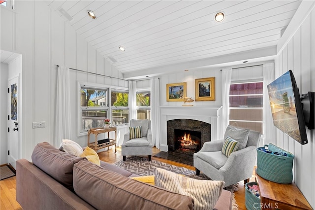430 Anita St, Laguna Beach, CA 92651 - living room featuring lofted ceiling, light wood finished floors, a premium fireplace, a decorative wall, and recessed lighting