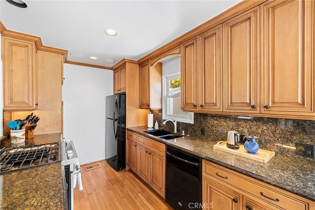 430 Anita St, Laguna Beach, CA 92651 - kitchen with black appliances, light wood finished floors, tasteful backsplash, dark stone counters, and recessed lighting