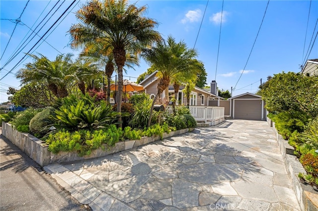 430 Anita St, Laguna Beach, CA 92651 - view of front of house with an outbuilding, a detached garage, and concrete driveway